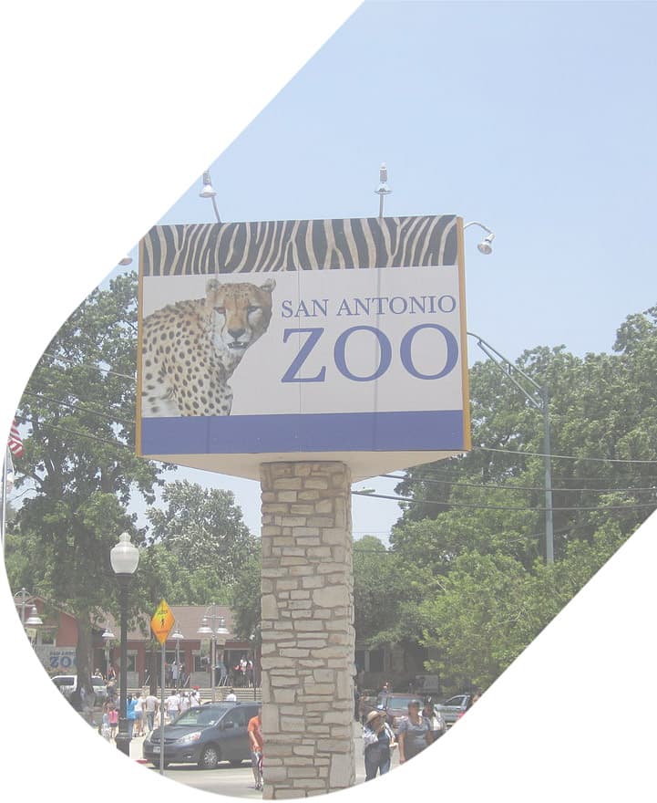 The entrance sign for the San Antonio Zoo